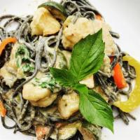Squid ink Pasta Creamy Green Curry · Green curry paste, coconut milk, limes leaves, Thai eggplant, green beans, basil, various be...