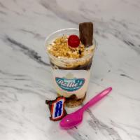 Snickers Parfait Sundae · Hot fudge, caramel, chopped nuts and fun sized snickers.