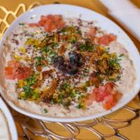 Hummus · Pureed chickpeas, tahini, lemon, nuts, and garlic drizzled with extra virgin olive oil, serv...