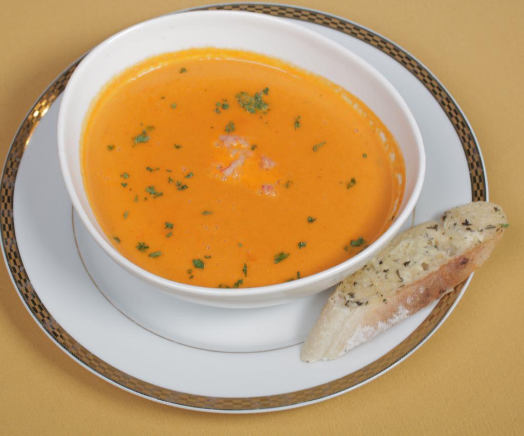Lobster Bisque Soup · French-style bisque with fresh lobster served with garlic bread.