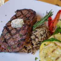 Ribeye · 12 oz. USDA prime seared to perfection with herb butter and fresh rosemary.