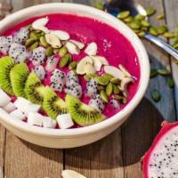 Pitaya Smoothie Bowl · Dragon fruit, mangoes, strawberries, kiwis, coconut cubes, pumpkin seeds and granola. Benefi...