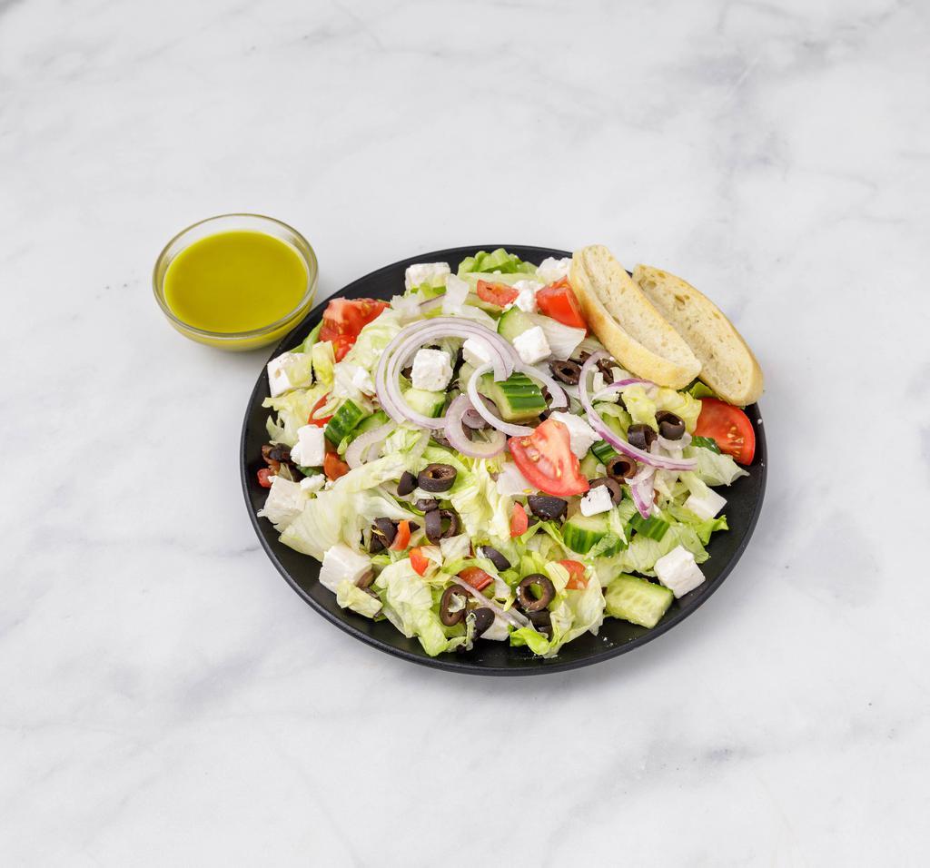 Greek Salad · Romaine hearts, diced cucumber, diced tomato, Kalamata olives, red onions, feta cheese and lemon mint dressing.