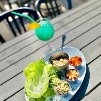 Teriyaki Chicken Lettuce Wraps · grilled teriyaki chicken - bibb lettuce cups - quinoa veggie blend - Mango pineapple salsa, ...