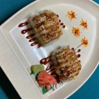 Big Twins Volcano Roll   · Scallop crabmeat masago mix on top California roll cream cheese then broiled with sauce crun...
