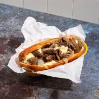 Classic Cheesesteak · Thinly sliced marinated Rib Eye, sauteed onions, your choice of cheese. Served on an Amoroso...