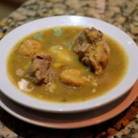 Sancocho · Traditional Spanish soup with cassava, plantains, beef and hen.