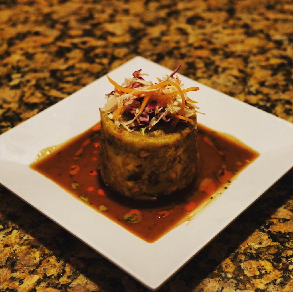 Mofongos · Traditional Caribbean dish of mashed fried green plantains or yucca (cassava), with garlic and olive oil and your choice of stuffing.