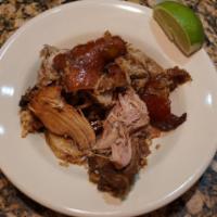 Pernil Asado · Slow roasted pork shoulder.  Served with your choice of side.