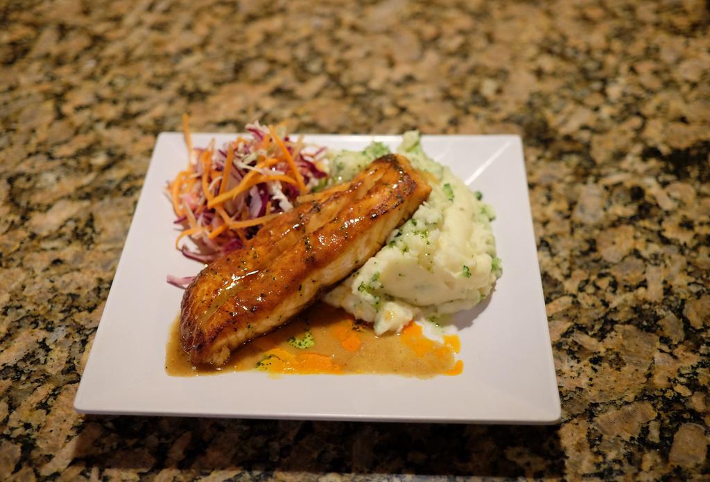 Salmon Glaciado · Pan-seared salmon filet with sweet mustard sauce. Served with your choice of side.