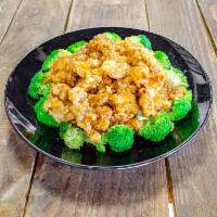 General Tso's Chicken · Tender chunky meat marinated and quickly fried till crispy. Served over steamed broccoli and...