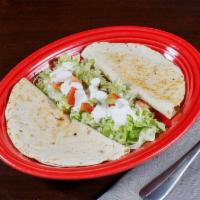 Quesadillas · Two Flat flour tortilla grilled and stuffed with Mexican cheese,  .  Beef or Chicken availab...