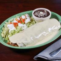 Steak Burrito · Steak grilled with bell peppers, onions and tomatoes. Topped with cheese sauce, lettuce, sou...