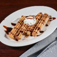 Churros · Long strips of dough fried and filled with pastry.