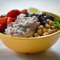 Nicoise · Tuna salad, Kalamata olives, egg, tomato and chickpeas. Made with a crispy blend of romaine ...