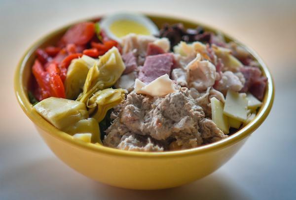 Antipasto · Roasted red peppers, tuna, salami, provolone cheese, slow roasted turkey, Kalamata olives, artichoke hearts and egg. Made with a crispy blend of romaine and iceberg.
