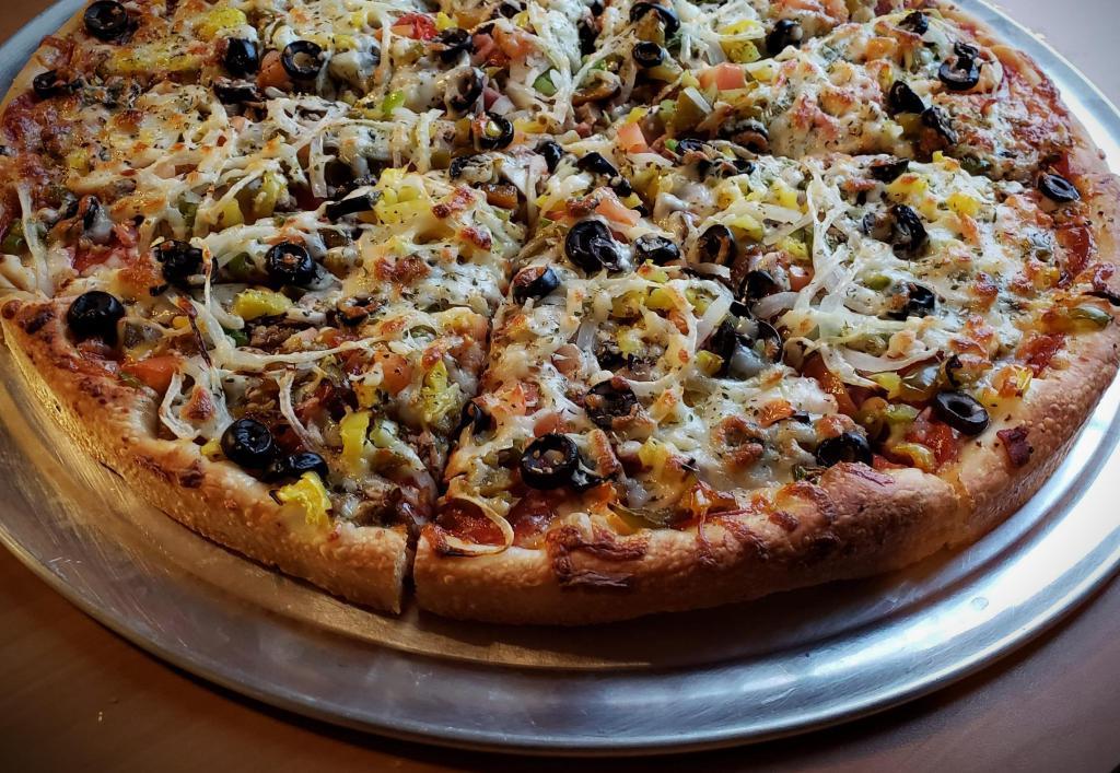 Pembroke Special Pizza · Pepperoni, mushroom, sausage, ham, salami, meatball, green peppers, onions, black olives, tomatoes, hot peppers, sweet peppers and extra cheese.