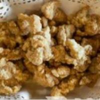 Popcorn Chicken · Bite sized, breaded, and fried chicken.