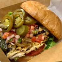 Loco Pollo (Grilled Chicken) Sandwich · Brined and grilled chicken breast served over lettuce and topped with roasted poblano, caram...