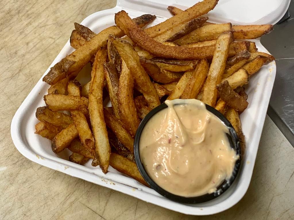 Hand Cut Fries · We cut fresh potatoes daily! Double-fried to a crispy golden brown and served with our house fry sauce - 