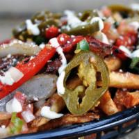 Down & Dirty Cheese Fry · Large hand-cut fresh fry with gooey house-queso cheese sauce and loaded with sauteed fajita ...