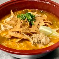Tortilla Soup · A bowl of warming and delicious Mexican tortilla soup. The broth is tomato-based and is vega...