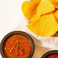Chips and Salsa · Homemade roasted tomato salsa served with tortilla chips.