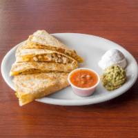 Quesadillas · Flour tortilla filled with a blend of cheeses served with sour cream and homemade salsa. Fil...