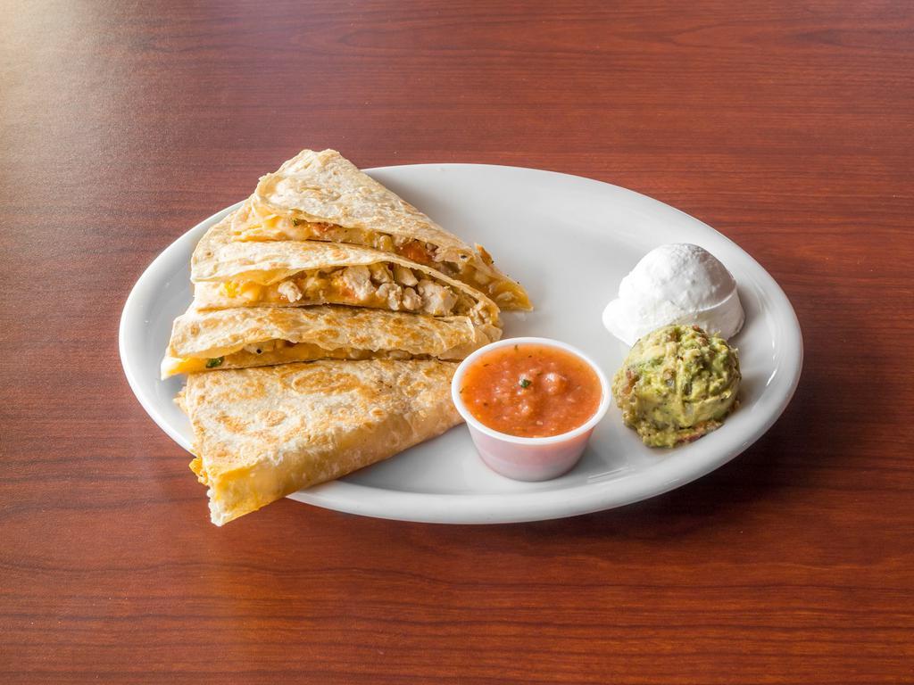 Quesadillas · Flour tortilla filled with a blend of cheeses served with sour cream and homemade salsa. Filled it with pork, beef or chicken for an additional charge.