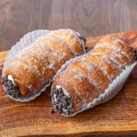Cartoccio · Doughnut dough, rolled, fried, cooled, filled w/ cannoli cream and dusted with a granulated ...