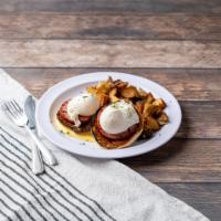 Traditional Eggs Benedict  · 2 poached eggs and Canadian bacon on an English muffin topped with hollandaise sauce