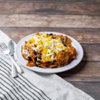 Breakfast Chilaquiles  · 2 eggs any style on a bed of tortilla chips, beans, chorizo, pepper Jack cheese, and sour cr...