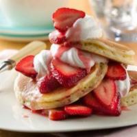 Strawberries and Cream Pancakes · Strawberries and whipped cream.