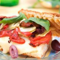 Mediterranean Panini · Fried red and green peppers, sweet roasted peppers, feta and humus.