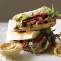 Steak Panini · Grilled steak, red onions, cheddar cheese and arugula.