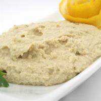 Hummus · Chickpeas spread blended with garlic and tahini.
