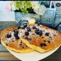 Buttermilk Pancakes · 3 fluffy golden brown pancakes with butter and syrup. Short stack - 2 pancakes. Add-ins: blu...