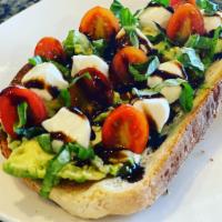 Caprese Avocado toast  · multi grain toast topped with avocado, fresh mozzarella, basil, cherry tomatoes, balsamic re...