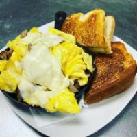 Eggcellent Skillet · 3 eggs, cheese and sausage on a bed of home fries and a side of toast.