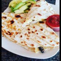 Breakfast Quesadilla · Scrambled eggs, peppers, onions, mushrooms, and cheese with salsa for dipping. Add avocado f...
