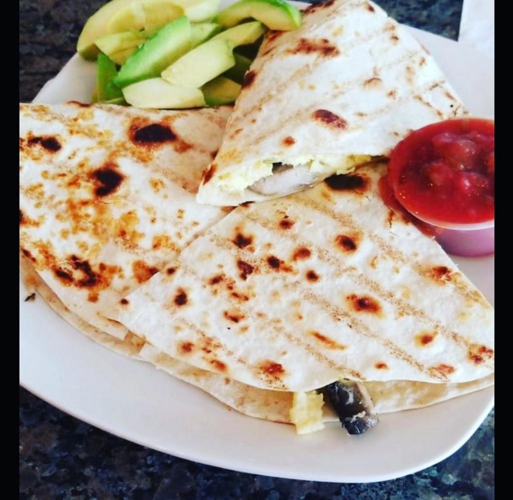 Breakfast Quesadilla · Scrambled eggs, peppers, onions, mushrooms, and cheese with salsa for dipping. Add avocado for an additional charge.