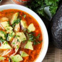 Chicken and Avocado Soup · Top notch homemade chicken soup with vegetables such as corn, bell peppers, onions, and othe...