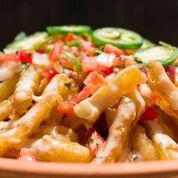 Loaded Fries · Natural cut fries with our signature queso blanco (served on the side for travel) and topped...