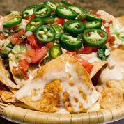 Pinches Nachos · 
Homemade tortilla chips topped with your choice of one our delicious meats (extra charge), then topped with queso blanco, shredded lettuce, pico de gallo, and fresh sliced jalapenos.