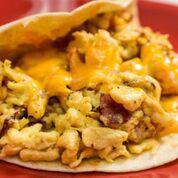 Bacon, Egg and Cheese Taco · Crispy bacon, scrambled eggs, and shredded cheddar-jack cheese in a warm flour tortilla.