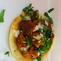 Chicharon Taco · Pork Rind braised in our red fusion salsa