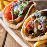 Gyro On Pita Sandwich · Include lettuce, tomatoes, onions and Tzatziki sauce.