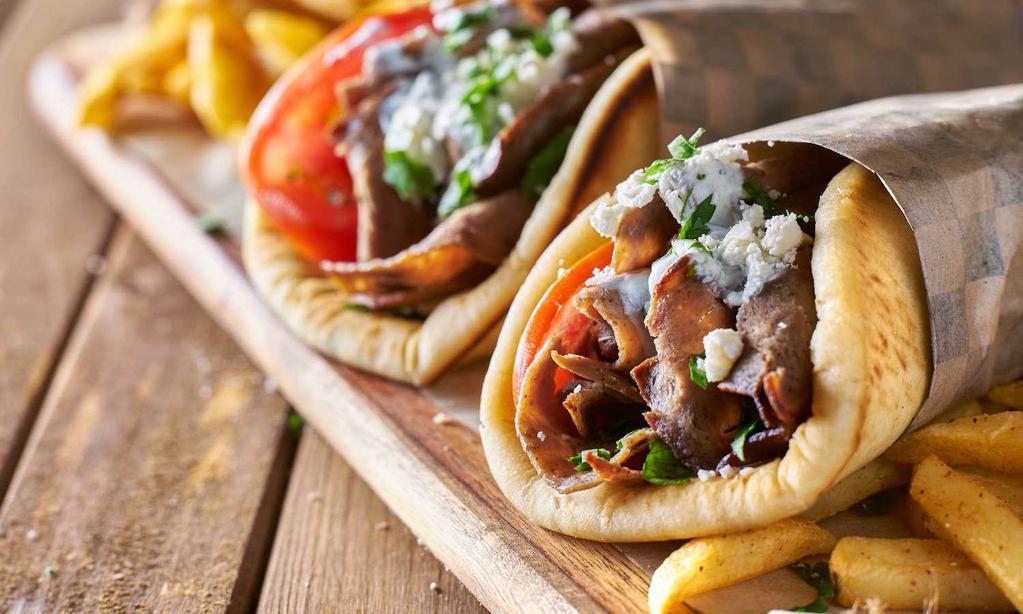 Gyro On Pita Sandwich · Include lettuce, tomatoes, onions and Tzatziki sauce.