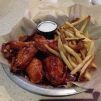 10 Pieces Hot Wings DELUXE · Served with french fries.