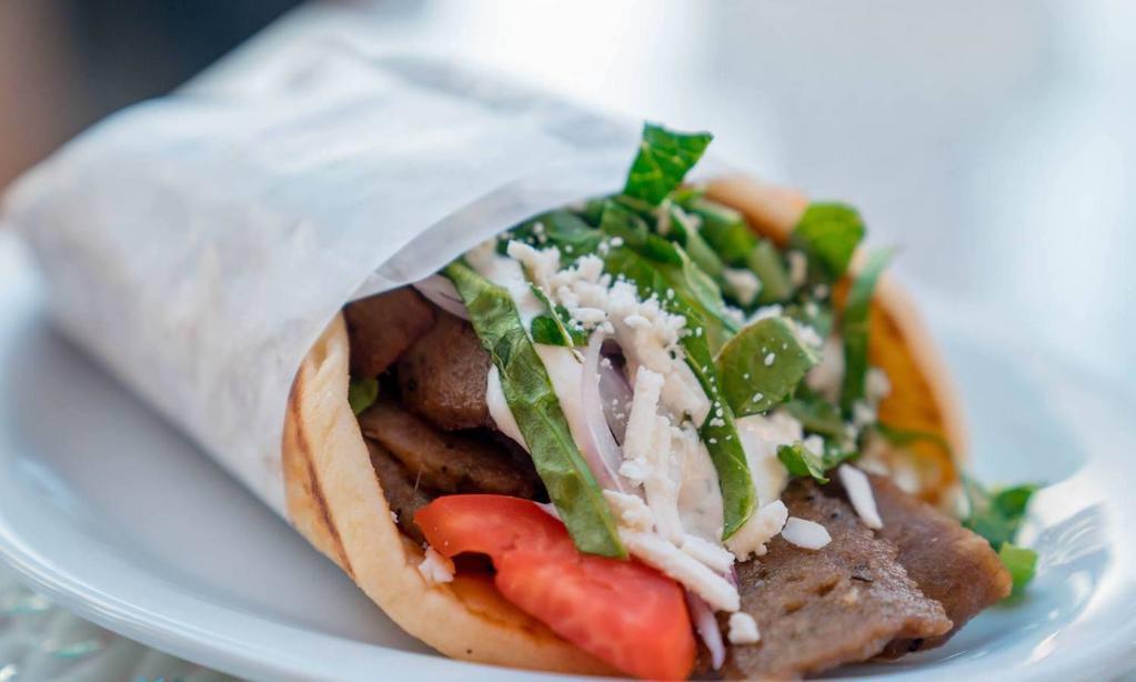 Greek Gyro Wrap · Gyro with Greek salad and tzatziki sauce. Deluxe platter served with french fries or house salad.